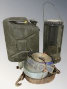 A jerry can, vintage gas heater and a bundle of canvas straps.