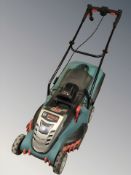 A Bosch electric lawnmower with charging pack.