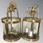 A pair of brass and glass cylindrical light fittings, height 47 cm.