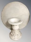 A composition stone garden pedestal table, diameter 121 cm.
