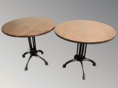 Three circular pub / bistro tables on painted metal supports,