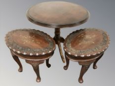 A reproduction circular occasional table and pair of brass eastern oval tables