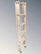 An aluminium extending ladder.