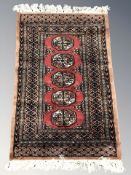 A Lahore Bokhara rug, Pakistan, 109 cm x 63 cm.