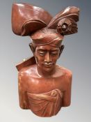 A carved Balinese figure 'Pearl Diver',
