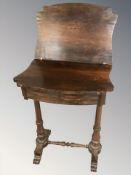 A 19th century rosewood turnover top occasional table fitted a drawer,