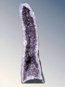 A very large and impressive amethyst geode specimen, 127 cm H x 44 cm W x 36 cm D,
