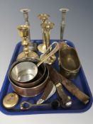 A group of brass and pewter candlesticks, pans, knives in sheathes, etc.