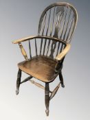 A 19th century elm spindle backed Windsor armchair,