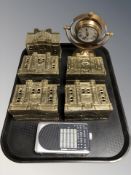 Four brass county bank money banks, a Roberts mini radio and a desk clock.