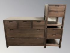 A modern five drawer chest and pair of matching bedside tables