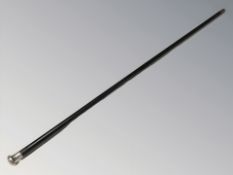 An ebonised walking cane with silver pommel,