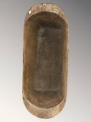 A rustic 19th century wooden dough board, length 73 cm.