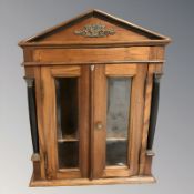 A reproduction glazed double door wall cabinet,