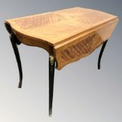 A French kingwood veneered rectangular drop leaf table, length 100 cm.