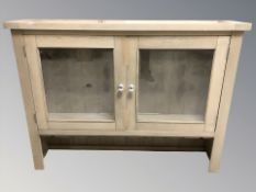 A contemporary glazed double door dresser top,