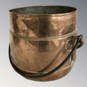 A copper swing handled cooking pot, height 23 cm excluding handle.