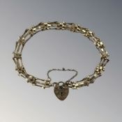 A 9ct gold padlock bracelet