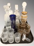 A group of glass decanters, amber flash cut vase and similar bowl, further blue flash cut vase,