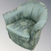 A 20th century armchair in turquoise upholstery,