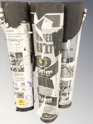 Four rolls of roofing felt.