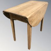 An early 20th century pine drop leaf table, length 85 cm.
