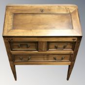 A reproduction stained pine fall front bureau, width 82 cm.