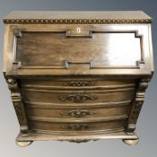 A 20th century continental oak bureau, 107 cm W x 49 cm D x 108 cm H.