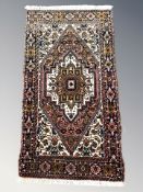 A Tabriz rug, North-West Iran, 98 cm x 52 cm.