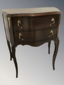 A continental reproduction serpentine front two drawer chest, width 57 cm.