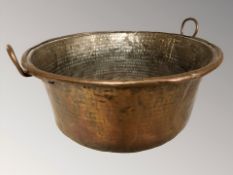 A 19th century copper twin handled wash pot,
