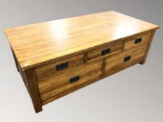 A modern oak five drawer low table, 140 cm x 72 cm x 49 cm.
