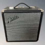 A Fender Rumble 15 amplifier.
