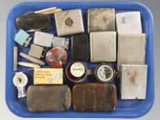 A group of cigarette cases, lighters, compasses, two leather and silver mounted cigar cases, etc.