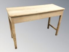 An early 20th century pine side table, 125 cm x 47 cm x 80 cm.