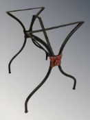 A wrought metal table stand, width 59 cm.