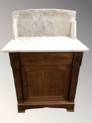 An early 20th century mahogany marble topped wash stand, with cupboard beneath,