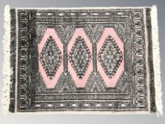 A Lahore Bokhara rug, Pakistan, 92 cm x 63 cm.