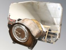 An Art Deco frameless mirror, width 58 cm, and a mantel clock.