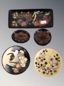 A Moorcroft shallow rectangular tray and four various pin dishes, tray 20 cm long.