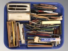 A group of writing utensils to include several fountain pens with 14 ct nibs including Waterman's,