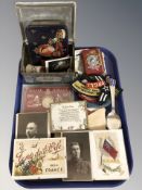 A group of military cloth insignia, tins, photographs, commemorative silver jubilee coin, spoons,