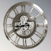 A reproduction skeletonised quartz wall clock, diameter 52 cm.