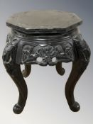 An oriental ebonised plant stand, height 45 cm.