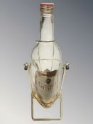 A large William Grants 3 litre whisky bottle on stand.