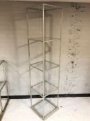 A metal and glass open shelf,