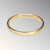 An 18ct gold band ring, size S½ CONDITION REPORT: 2.