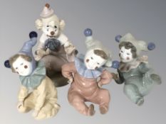 Four Nao figures of clown children.
