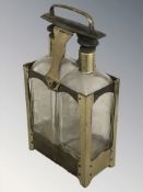 A brass two bottle decanter stand, height 32 cm.