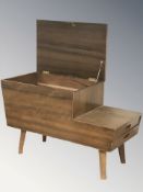 A 20th century teak work box, width 75 cm.